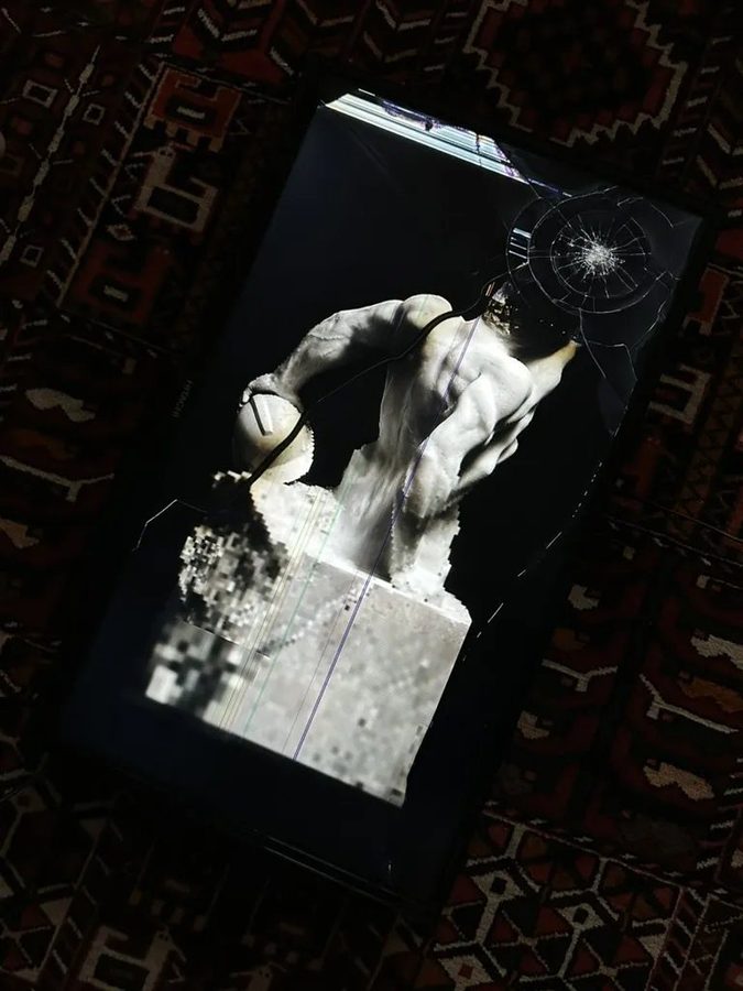 Non Finito (The Builder), Broken screen on Persian rug, 2025